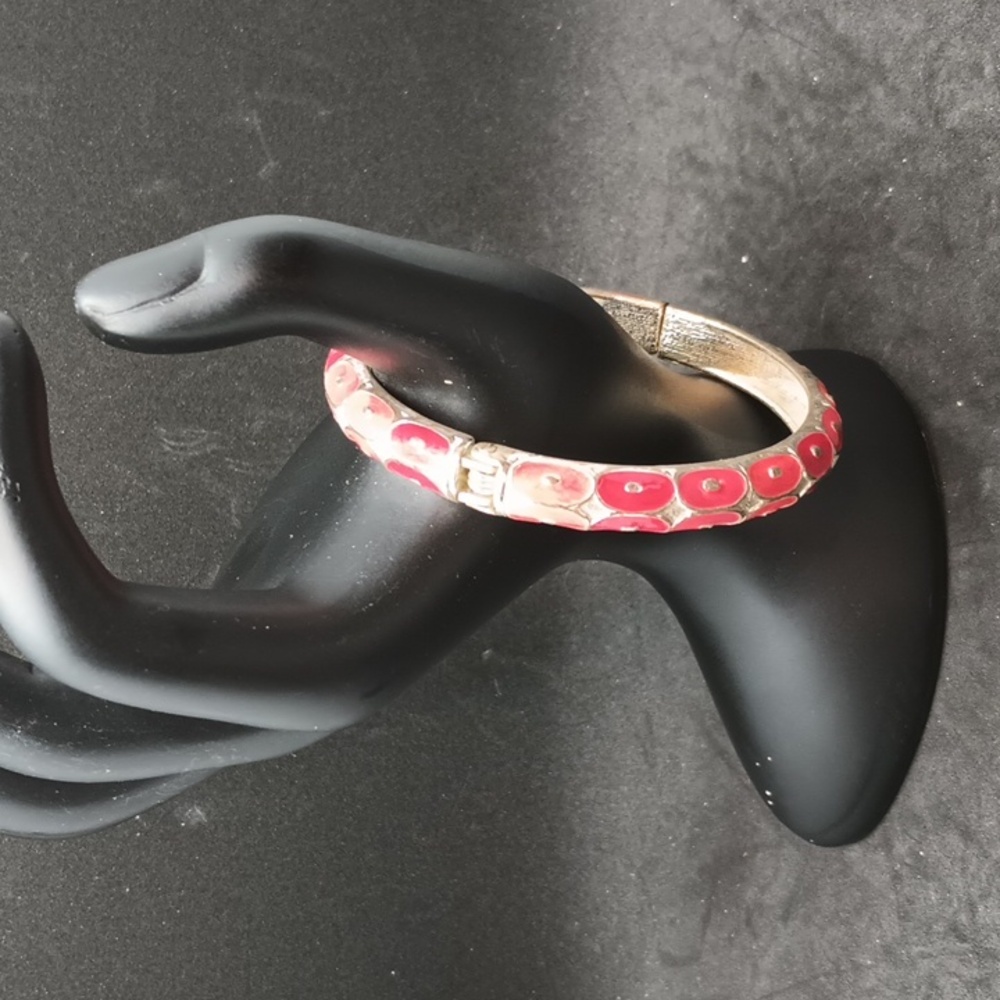 Pink silver tone circle pattern hinge bracelet